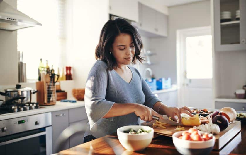 Woman prepping food on counter