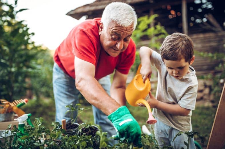 Man and boy working in garden