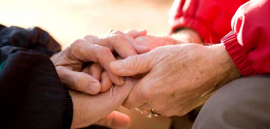 Two people holding hands.